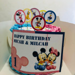 Twins round theme cake